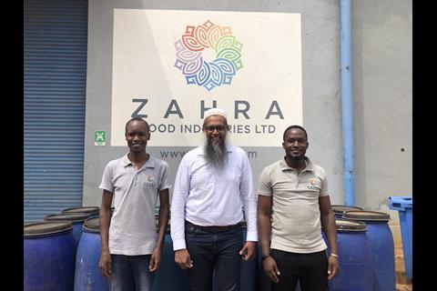 Quresh Fidahusein (centre) and his production team at Zahra's processing plant in Kampala
